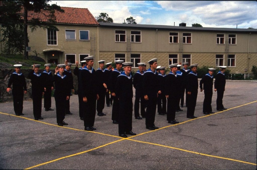 A squad ready for formation. The main barracks in the background (demolished)